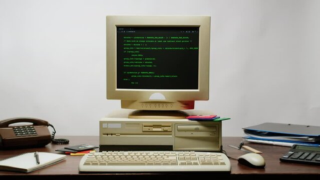 Retro pc with loading code console, programmer making scripts, green basic screen, Old computer studio close-up, Desktop vintage retro wave display, late 90s PC.