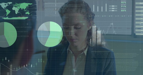 Caucasian female, looking at transparent futuristic screen with data