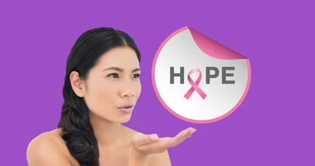 Deurstickers Aziatische plekken Asian nurse holding symbol for breast cancer awareness