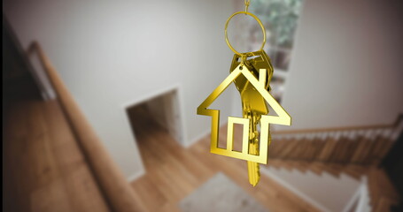 Child holds keychain shaped like a golden house, blurring stairs in the background