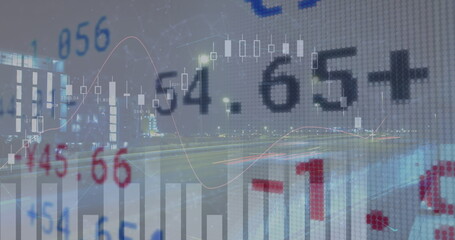 Financial graphs and numbers overlay on blurry cityscape background