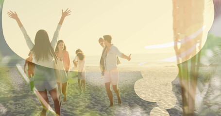 Group of friends enjoying time on beach, arms raised, laughing - obrazy, fototapety, plakaty