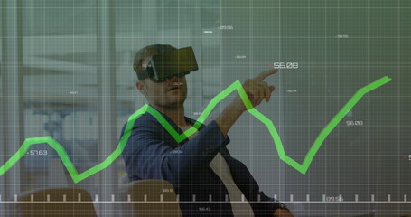 Caucasian male instructor wearing virtual reality headset pointing at graph - 788804585