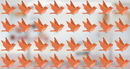 Multiple orange birds with wings spread are repeating across background