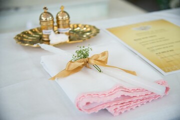 Wedding table set with a candle on a napkin