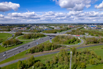 Aerial overview of dramatic clouds above transit roundabout Hoevelaken intersection near Amersfoort...