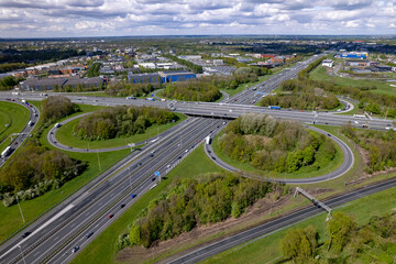 Greenery islands aerial of transit roundabout Hoevelaken intersection circle in Dutch landscape. Urban transportation infrastructure 