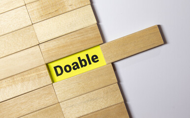doable colorful word on the wooden background. - obrazy, fototapety, plakaty