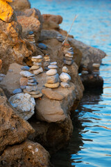 Fototapeta na wymiar Many ZEN stones on the sunset beach.