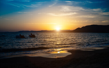 Beautiful sunset on Pefki beach on the island of Rhodes in Greece.