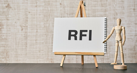 There is notebook with the word RFI. It is an abbreviation for Request For Information as eye-catching image.
