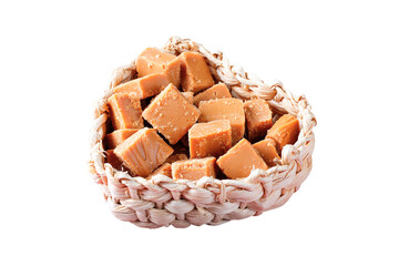diced caramel candy in basket. Traditional sweet from Brazilian country festivals isolated white background
