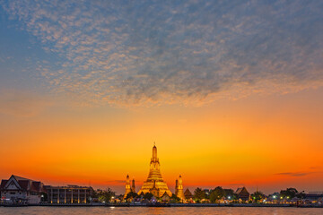 Wat Arun Ratchawararam Ratchawaramahawihan at sunset in bangkok Thailand. Landmark of Along the...