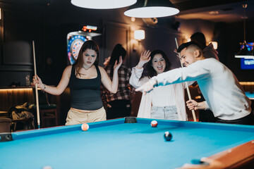 Group of young adults enjoying a leisurely game of billiards in a cozy bar setting, sharing laughs and good times.