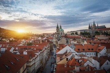 Aerial view of Mala Strana at sunset with St. Nicholas Church and Prague Castle - Prague, Czech...