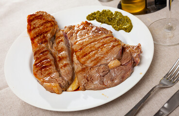 Delicious entrecote with pesto sauce. High quality photo