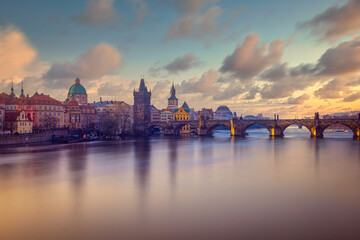Cityscape view of Charles bridge in long exposure with beautiful sky, Prague