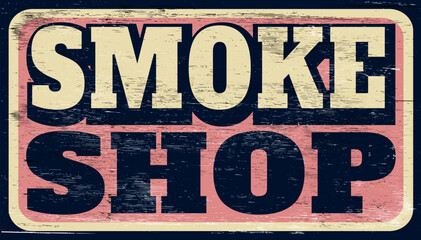 Aged and worn smoke shop sign on wood