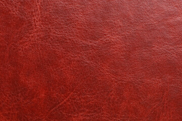 A red leather surface with a shiny finish