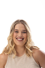 Caucasian young female plus size model on white background wearing sleeveless top, smiling at camera - 788839921