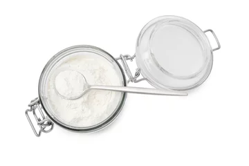 Fotobehang Baking powder in glass jar and spoon isolated on white, top view © New Africa