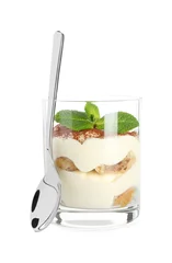 Fotobehang Delicious tiramisu in glass, mint leaves and spoon isolated on white © New Africa