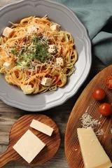 Fotobehang Vegetarian meal. Tasty pasta with fresh microgreens and cheese on wooden table, flat lay © New Africa