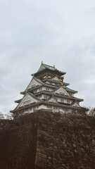 Osaka, Japon. March 28, 2024:  Osaka castle tower on a gray day.