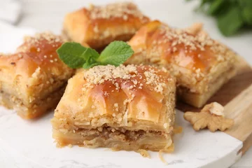 Plexiglas foto achterwand Eastern sweets. Pieces of tasty baklava on table, closeup © New Africa