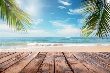 Fototapeten Summer tropical sea with waves, palm leaves and blue sky with clouds. Perfect vacation landscape with empty wooden table - generative ai © Nia™