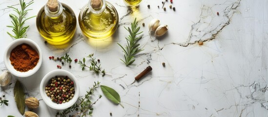Spices, herbs, and olive oil displayed on a white stone table, creating a background for cooking.