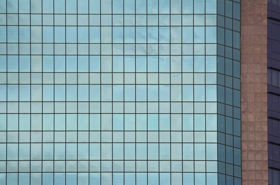 Glass curtain wall on a sky scrapper building, background