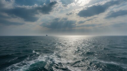 Fototapeta premium Lonely cargo ship on a vast ocean horizon