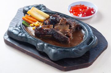 Steak Iga or Rib Steak in Hot plate