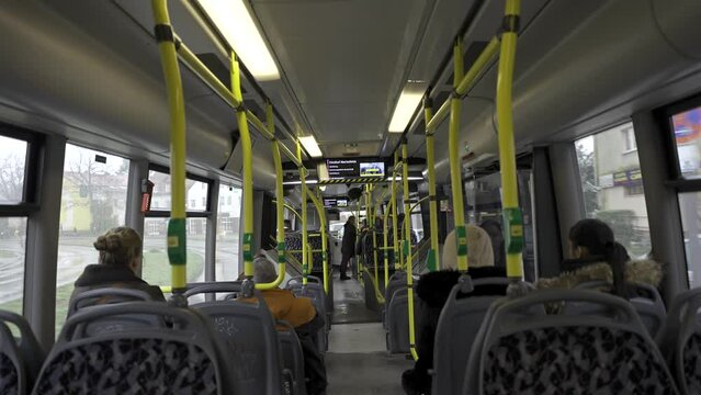 Germany, Berlin. Municipal bus BVG, Berliner Verkehrsbetriebe view from inside from passenger seat. Interior of yellow city bus on route in Berlin. Public transportation in Germany. 
