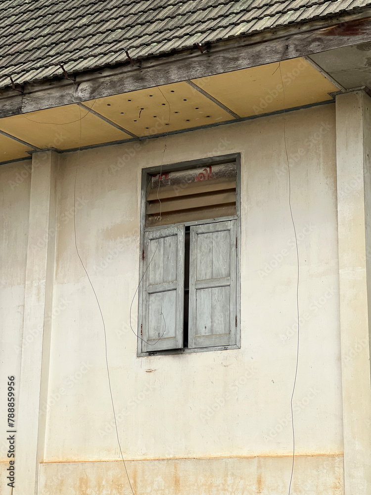 Canvas Prints old wooden window on cement wall