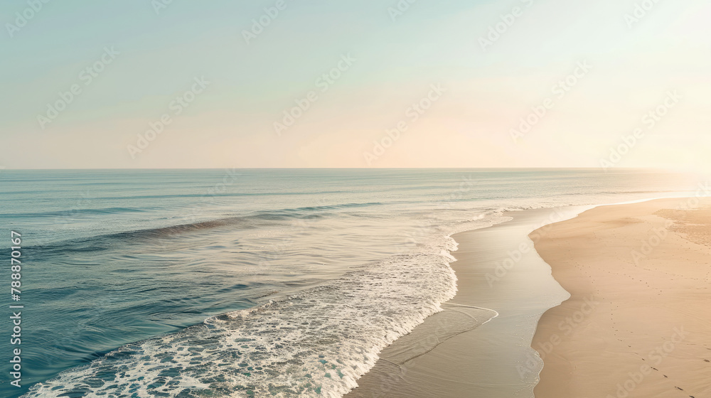 Wall mural Beautiful sunrise over tranquil beach with gentle waves and clear skies