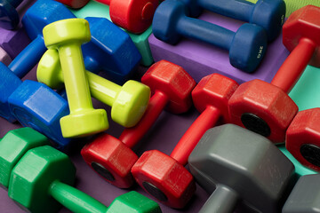 group of multicolored dumbbells for background