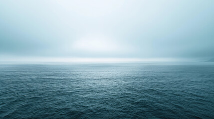 Peaceful ocean expanse under overcast skies in soothing shades - obrazy, fototapety, plakaty