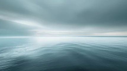 Fotobehang Peaceful ocean expanse under overcast skies in soothing shades © boxstock production
