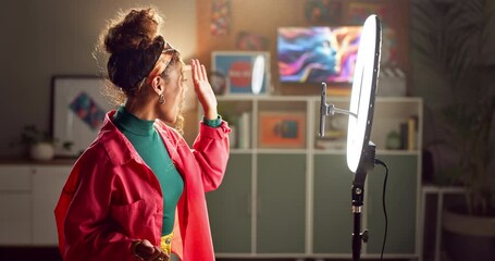 Influencer, phone and woman wave for live streaming audience on social media, mobile app and website. Night, home and person with ring light recording on smartphone for internet, networking and vlog