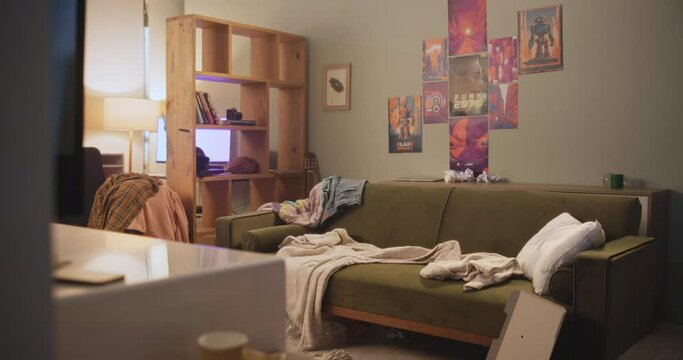 Home, garbage and messy living room with couch, chaos and fast food pizza, unhealthy and interior furniture with clothes. Apartment, trash and clutter on sofa or floor, dirty and disorganized