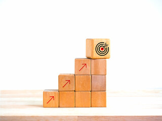 Arrow upward to the target icon symbol on wooden cube blocks, bar graph chart steps on white background, profit planning, marketing passive income, business growth process concepts, minimal style.
