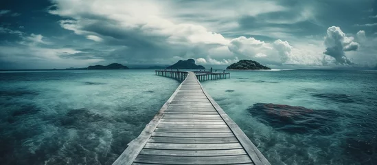 Türaufkleber tropical summer travel and vacation. wooden pier to an island © WaniArt