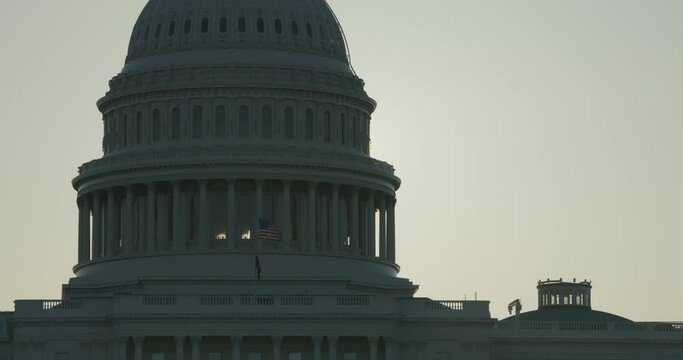 U.S. Capitol Dome Silhouetted with Sunrise Appearing