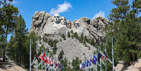 Mount Rushmore National Memorial with state flags in summer, South Dakota