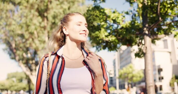 City, park and happy walk with woman in fashion or casual streetwear of college student on campus. Calm, morning and girl relax in summer clothes and enjoy path in sunshine on holiday or vacation