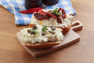 bruschetta with soft cheese capers and tomato