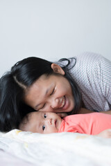 Infant Girl with Asian Mother