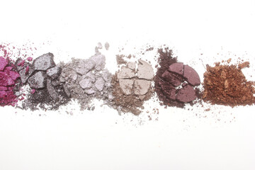 Broken Cosmetic Pigments on light colored background